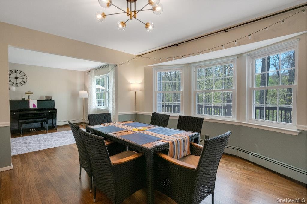 34 Jackson Road Briarcliff Manor, NY 10510 - Photo 11 of 29 a view of a dining room with furniture window and wooden floor