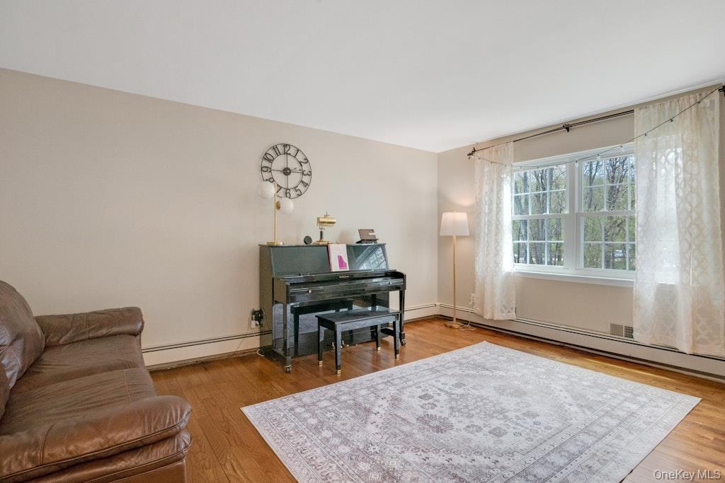 34 Jackson Road Briarcliff Manor, NY 10510 - Photo 12 of 29 a living room with furniture and a wooden floor