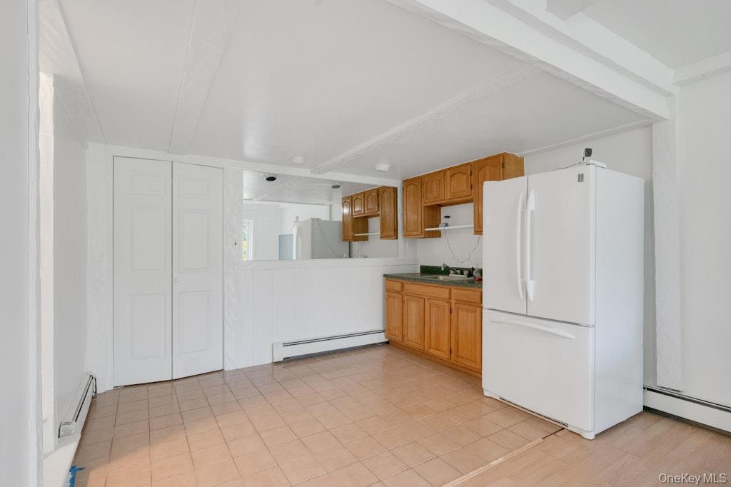 34 Jackson Road Briarcliff Manor, NY 10510 - Photo 23 of 29 a kitchen with stainless steel appliances a refrigerator and a stove