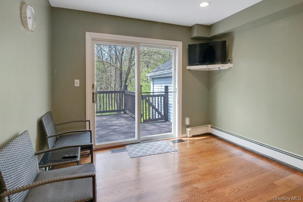 34 Jackson Road Briarcliff Manor, NY 10510 - Photo 6 of 29 a view of an empty room with wooden floor and a window