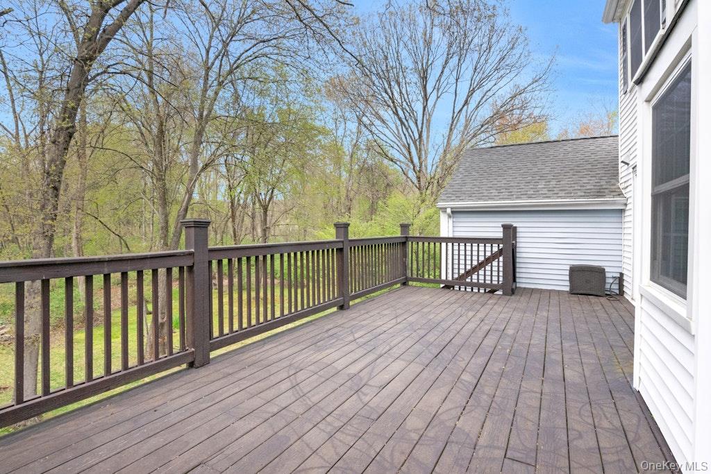 34 Jackson Road Briarcliff Manor, NY 10510 - Photo 8 of 29 a view of a wooden deck with a yard