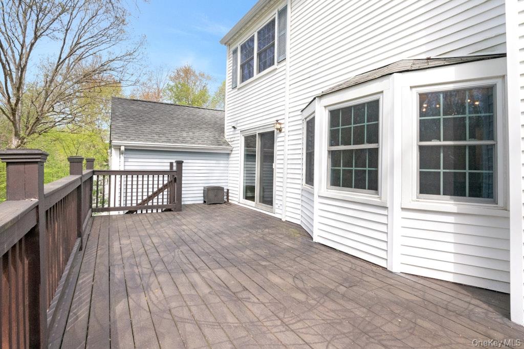 34 Jackson Road Briarcliff Manor, NY 10510 - Photo 9 of 29 a view of a house with a wooden deck