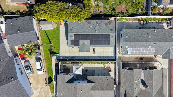 an aerial view of a house with a swimming pool