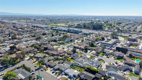 an aerial view of a house with large garden and patio