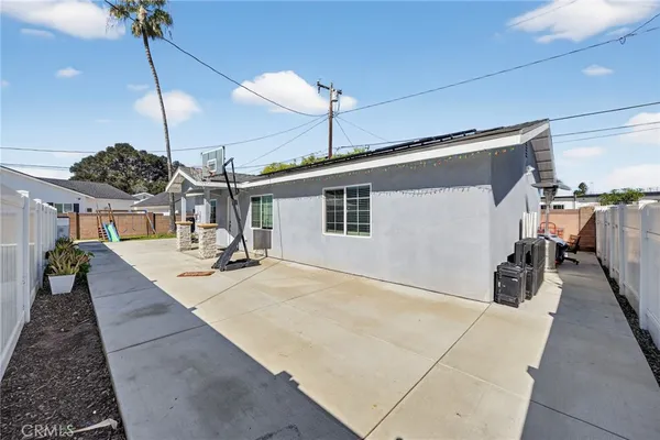 a kitchen with stainless steel appliances granite countertop a refrigerator sink and stove