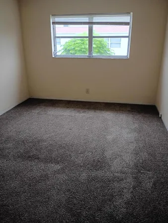 a white toilet sitting next to a shower