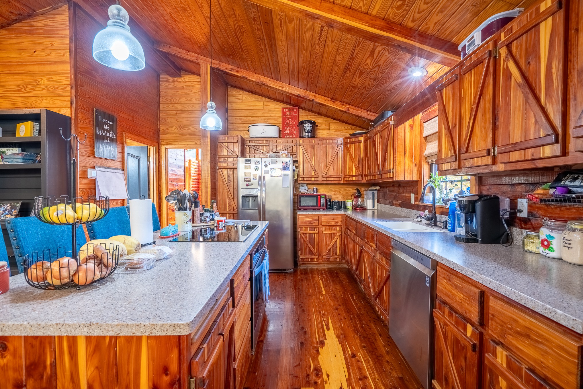 999 Rainbow Lake Road Waynesboro, TN 38485 - Photo 11 of 44 a kitchen with stainless steel appliances granite countertop a sink and cabinets