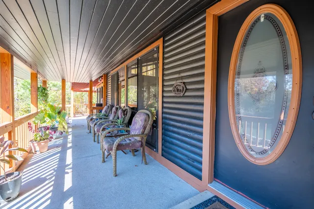 a view of a livingroom with furniture and a window
