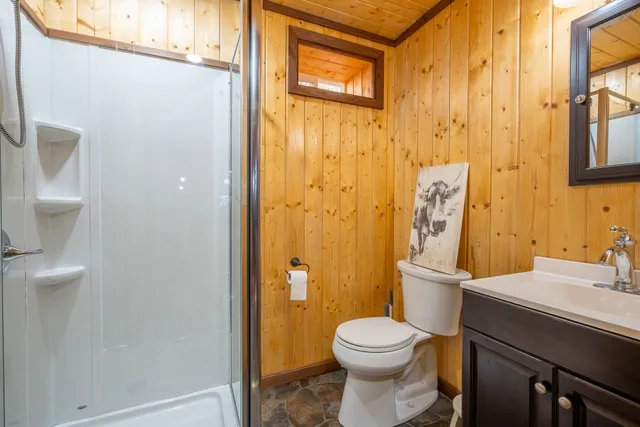 a white toilet sitting next to a bathroom sink