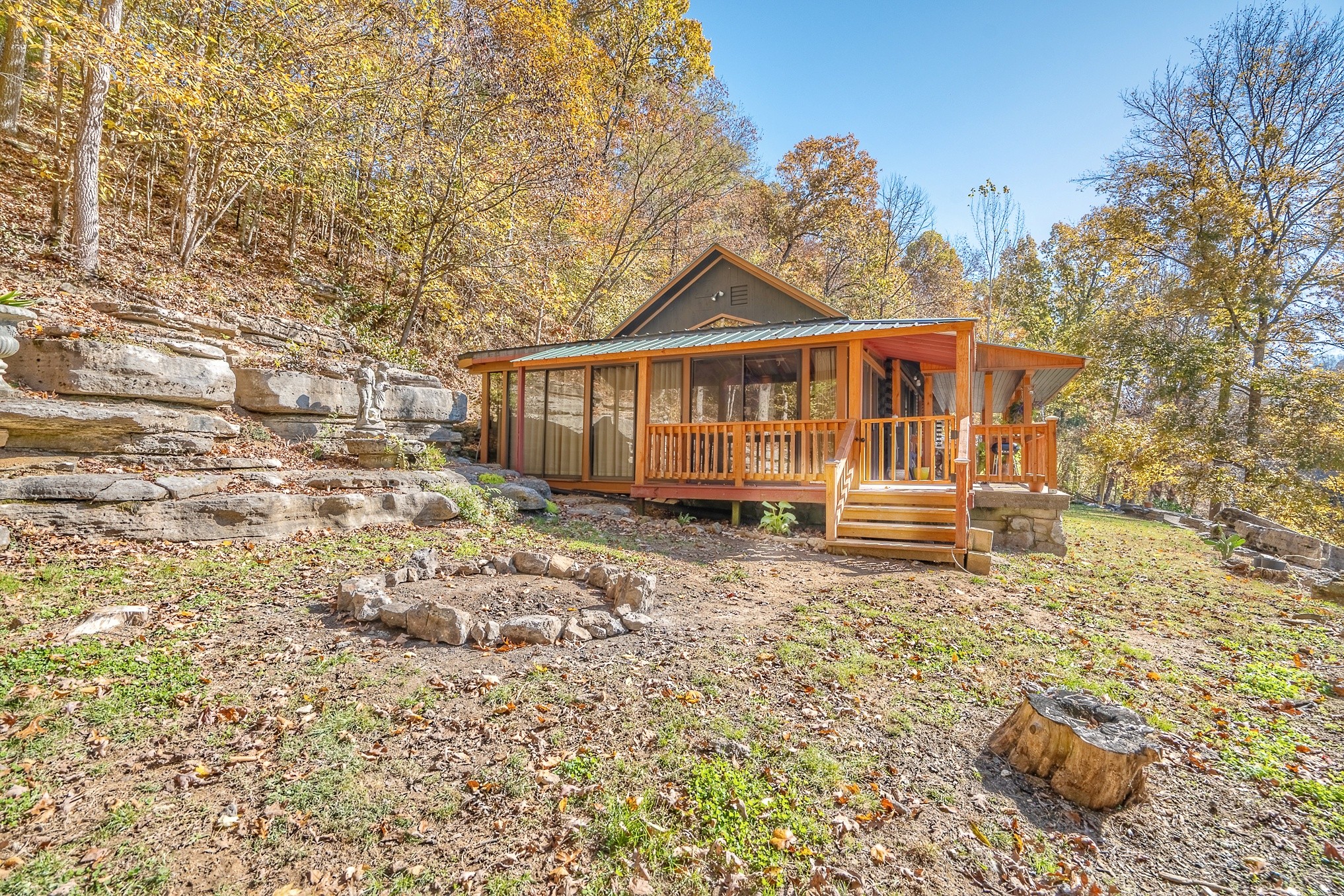 999 Rainbow Lake Road Waynesboro, TN 38485 - Photo 35 of 44 a view of a house with a small yard and wooden fence