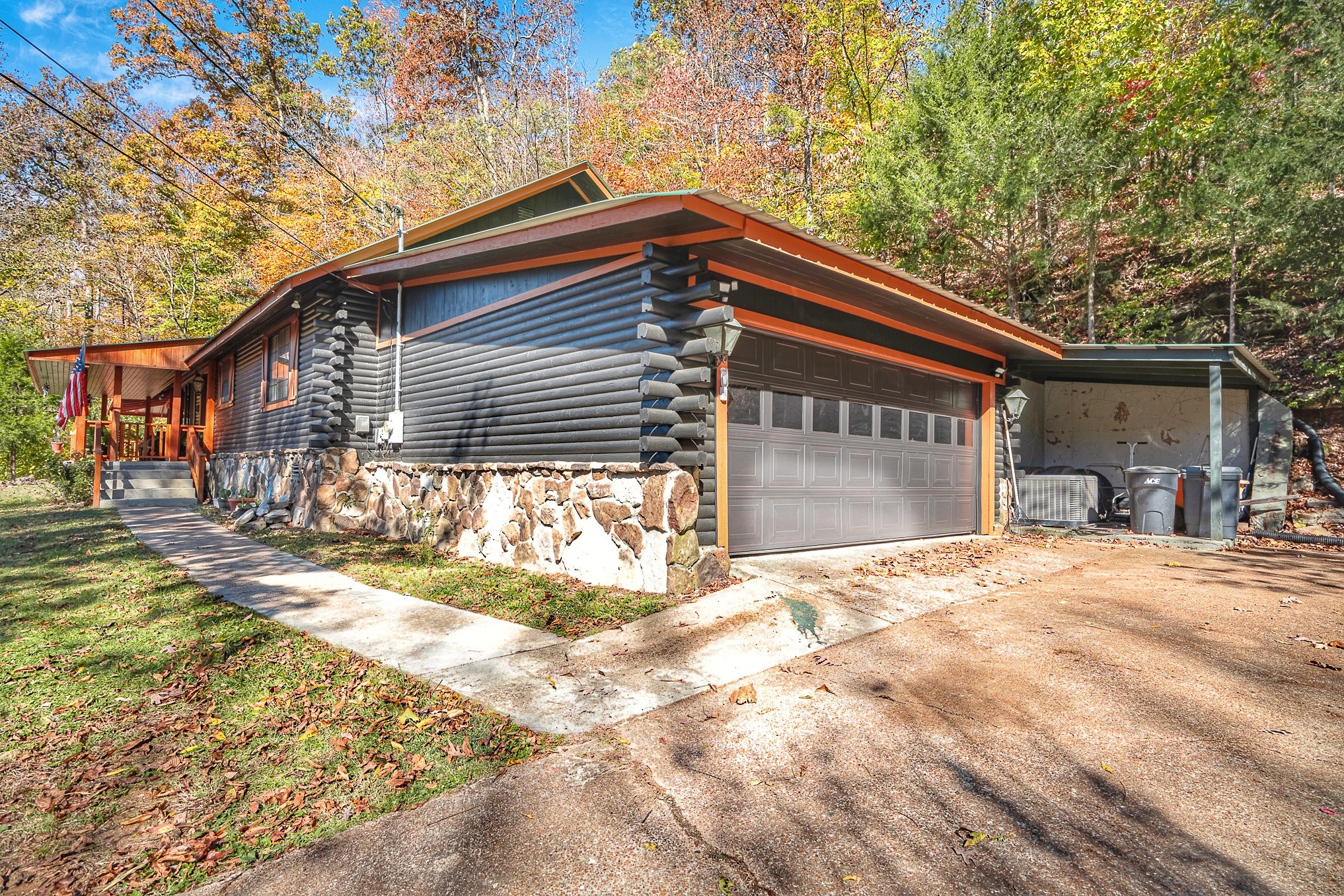999 Rainbow Lake Road Waynesboro, TN 38485 - Photo 37 of 44 a front view of a house with a yard and garage
