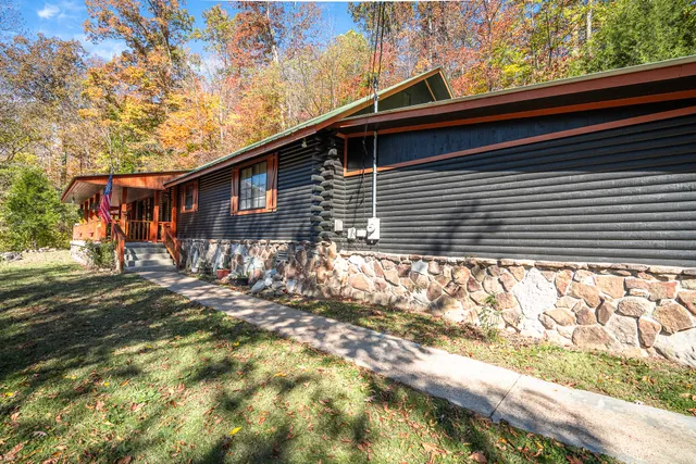 a backyard of a house with table and chairs