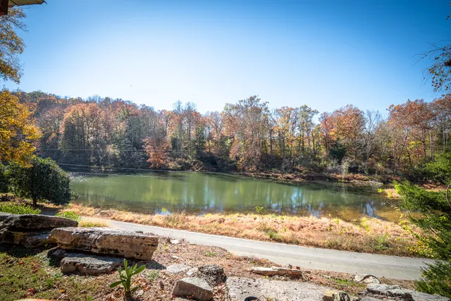 a view of a lake with trees by side of it