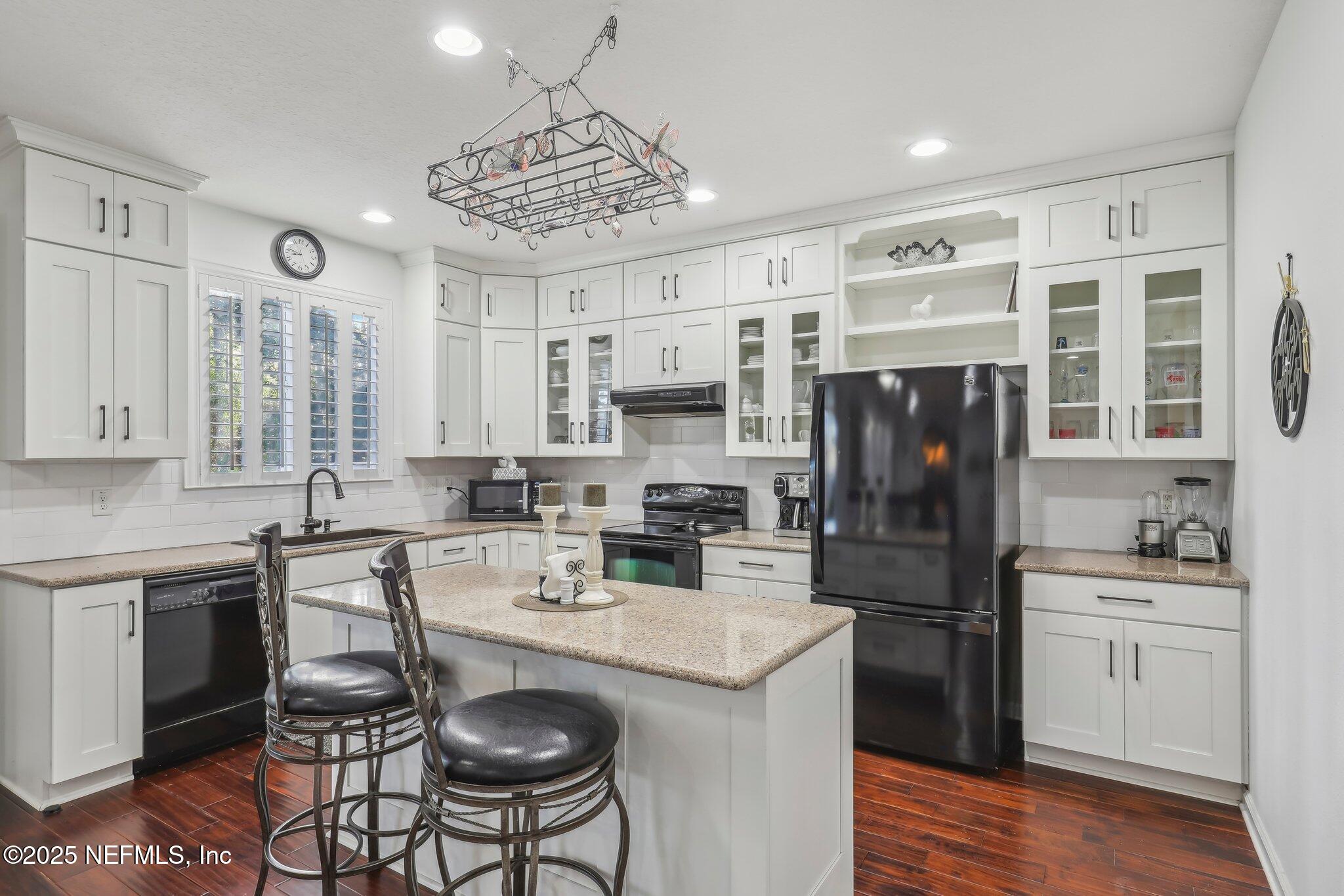 216 Brantley Harbor Drive St. Augustine, FL 32086 - Photo 12 of 33 a kitchen with a sink stove and refrigerator