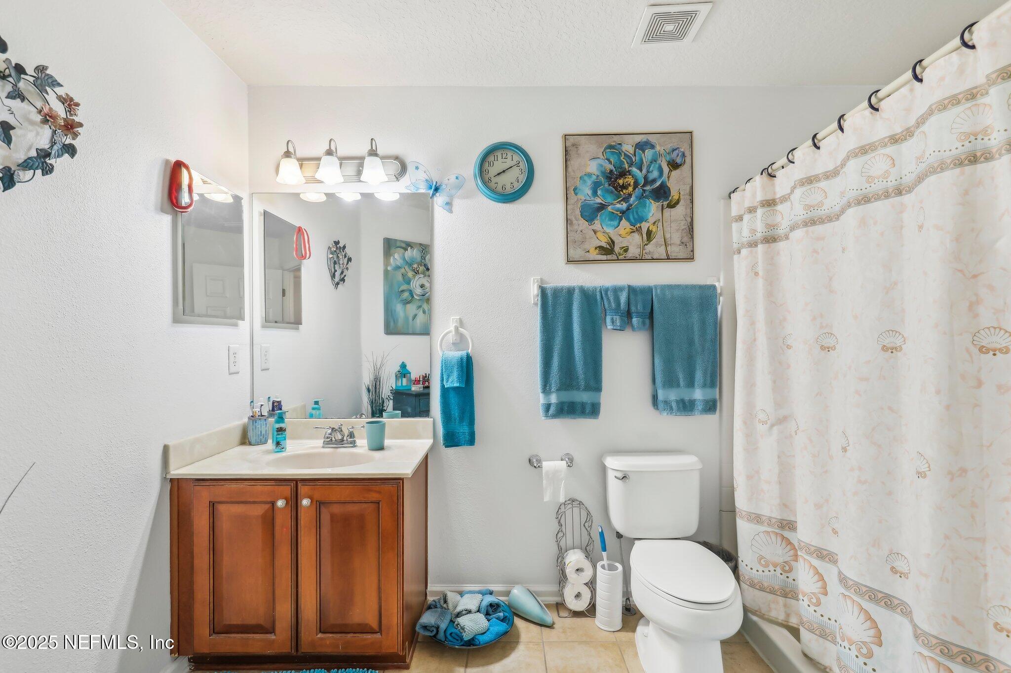 216 Brantley Harbor Drive St. Augustine, FL 32086 - Photo 19 of 33 a bathroom with a sink a toilet and a mirror