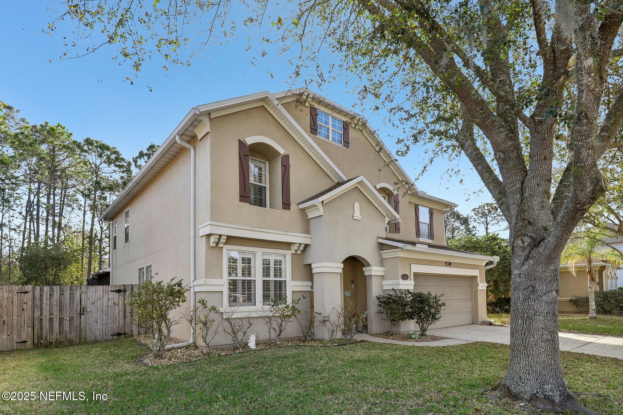 216 Brantley Harbor Drive St. Augustine, FL 32086 - Photo 2 of 33 a front view of house with yard and green space