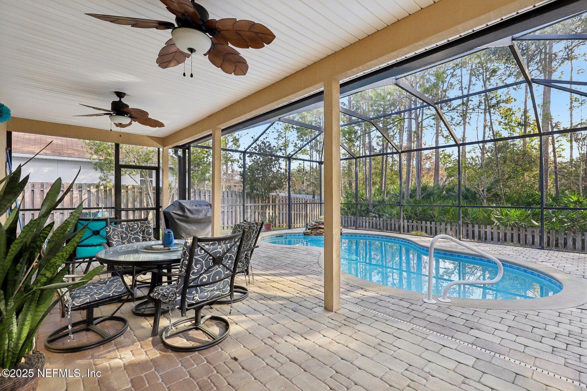 216 Brantley Harbor Drive St. Augustine, FL 32086 - Photo 27 of 33 a view of a porch with furniture and a yard