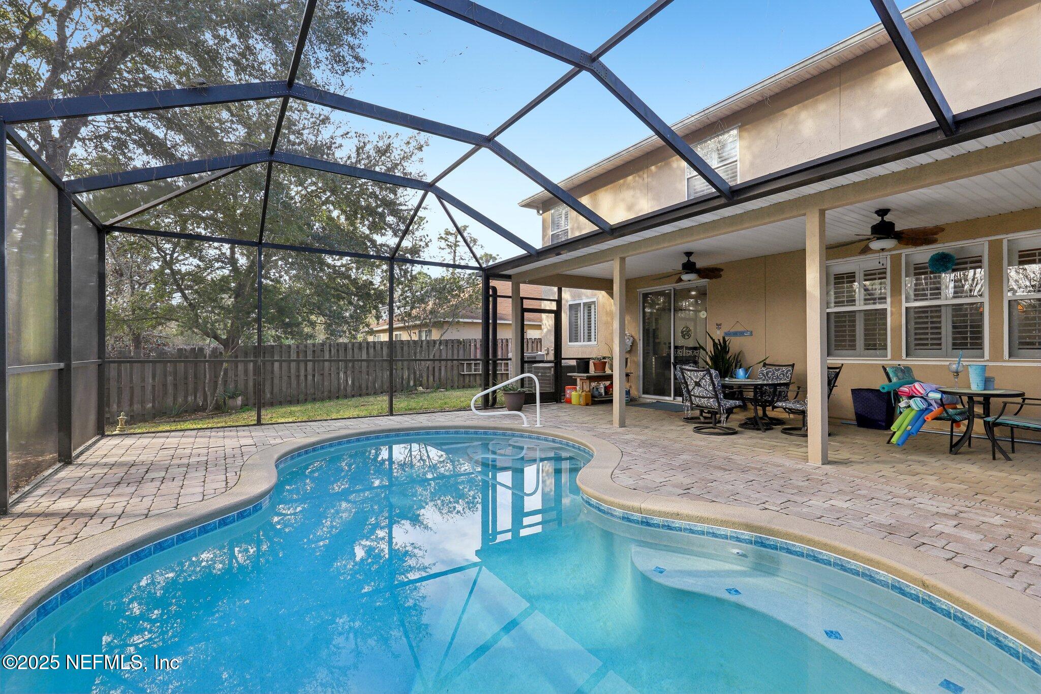 216 Brantley Harbor Drive St. Augustine, FL 32086 - Photo 28 of 33 a view of a swimming pool with a patio and a yard