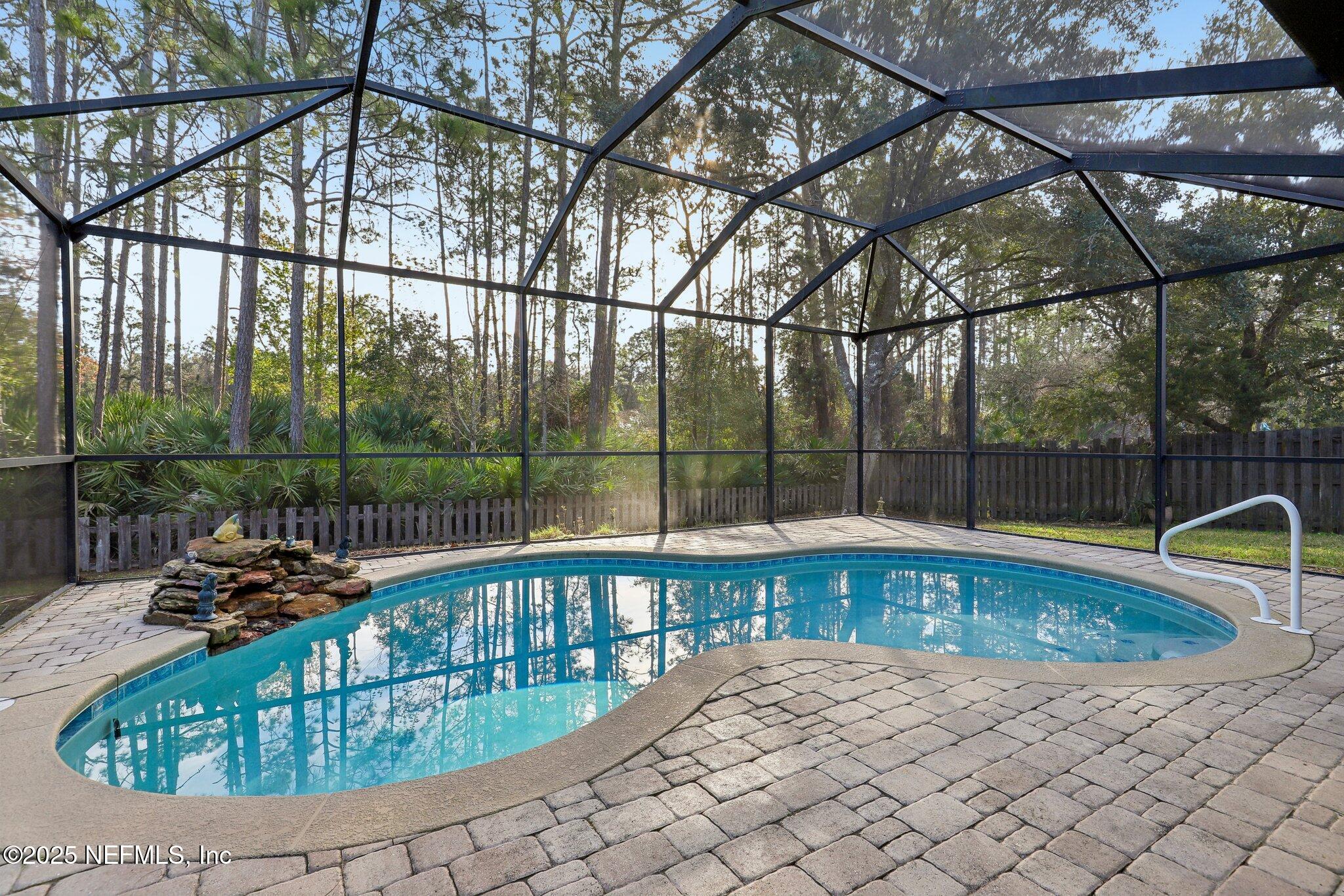 216 Brantley Harbor Drive St. Augustine, FL 32086 - Photo 29 of 33 a view of a swimming pool with a couches chair and tables
