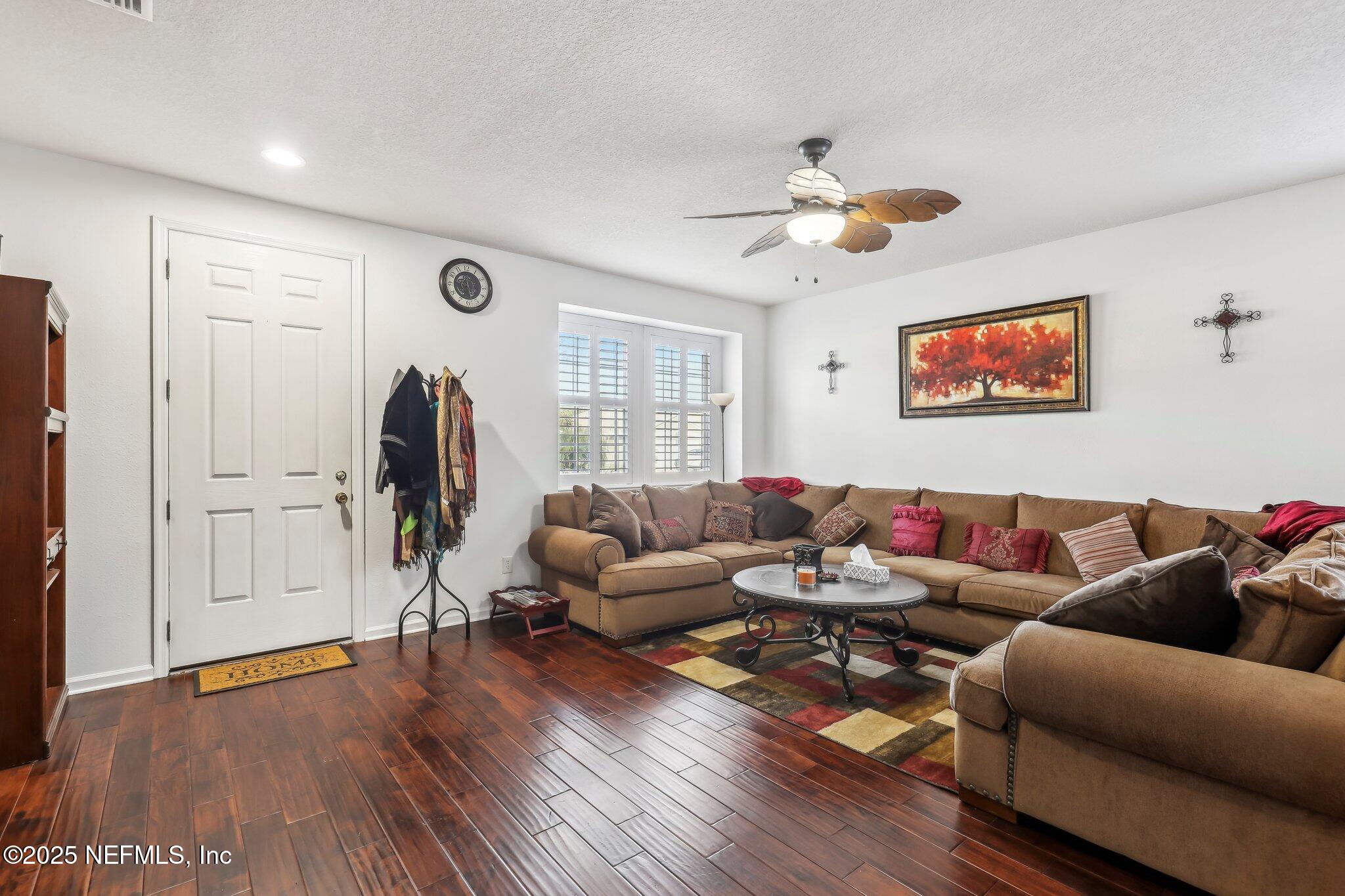 216 Brantley Harbor Drive St. Augustine, FL 32086 - Photo 5 of 33 a living room with furniture and a wooden floor