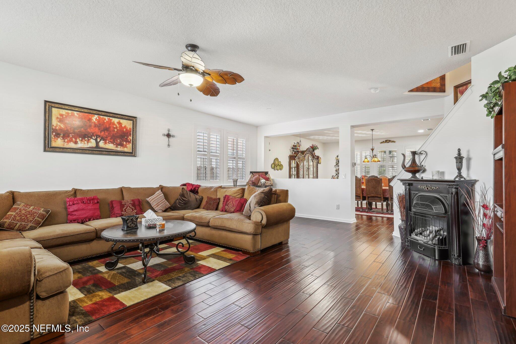 216 Brantley Harbor Drive St. Augustine, FL 32086 - Photo 7 of 33 a living room with furniture and wooden floor