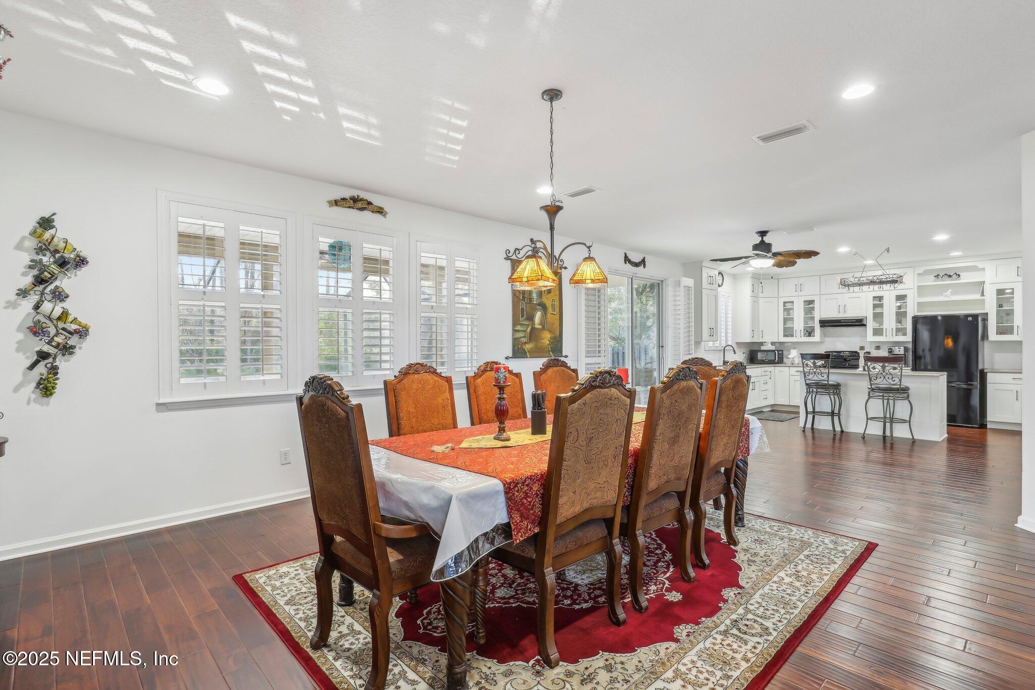 216 Brantley Harbor Drive St. Augustine, FL 32086 - Photo 9 of 33 a view of a dining room with furniture window and wooden floor