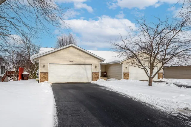 a view of a house with a snow in yard