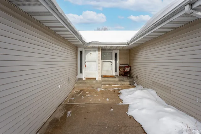 a view of a backyard with a large tree