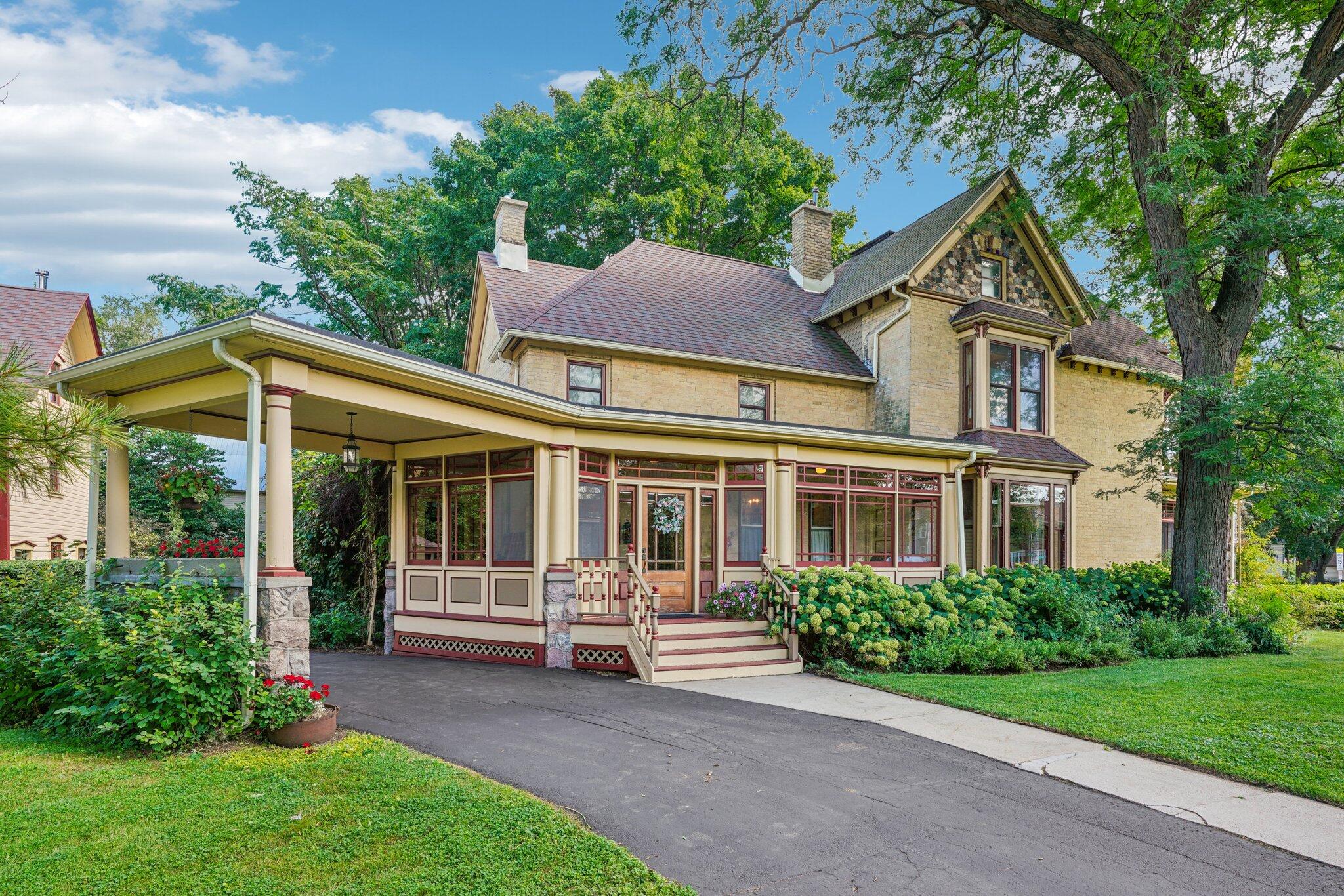 Must see home and amazing 1 acre setting in the City limits of Elkhorn