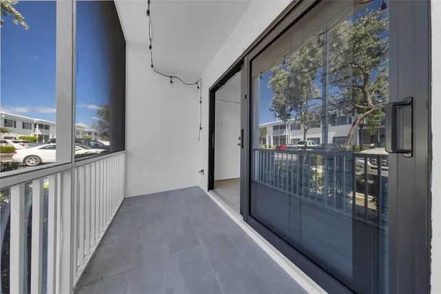 a view of a big room with windows