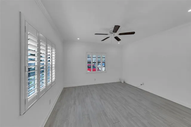 a bathroom with a toilet sink a mirror and shower