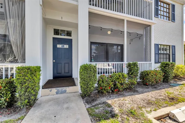 a view of a swimming pool with outdoor seating