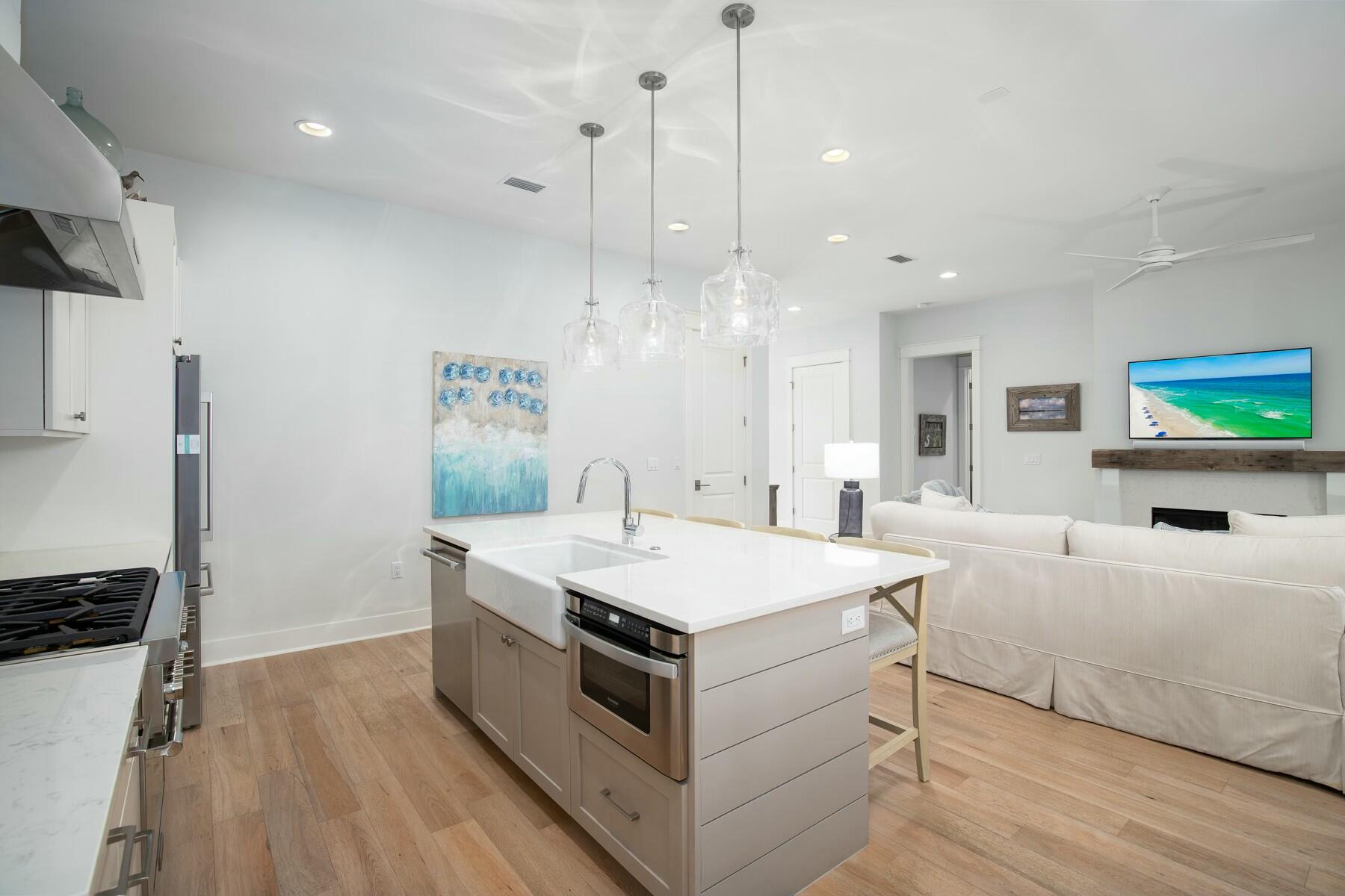 91 Catface Dr Inlet Beach Inlet Beach, FL 32461 - Photo 8 of 23 a large white kitchen with a large island oven a sink appliances and a counter top