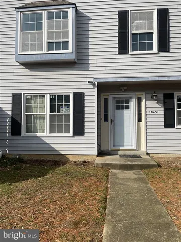 a house with a window and balcony