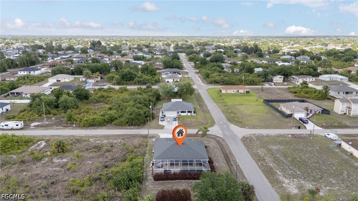 3801 28th Street Southwest Lehigh Acres, FL 33976 - Photo 34 of 37 an aerial view of residential houses with outdoor space and swimming pool