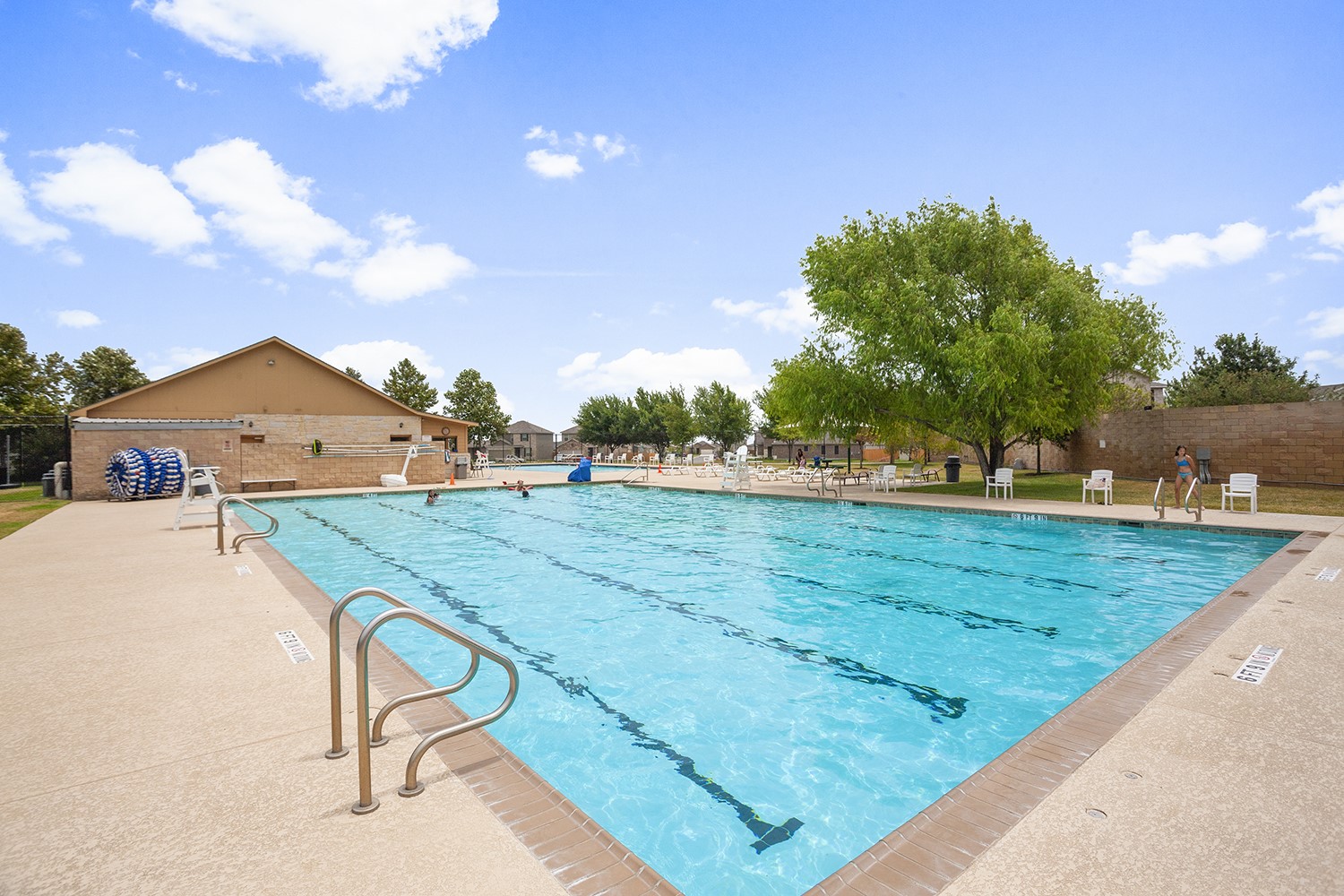 257 Firefox Way Jarrell, TX 76537 - Photo 4 of 12 A refreshing community pool invites residents to relax and enjoy the clear water on a sunny day.