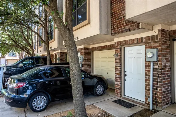a view of a car parked front of a house