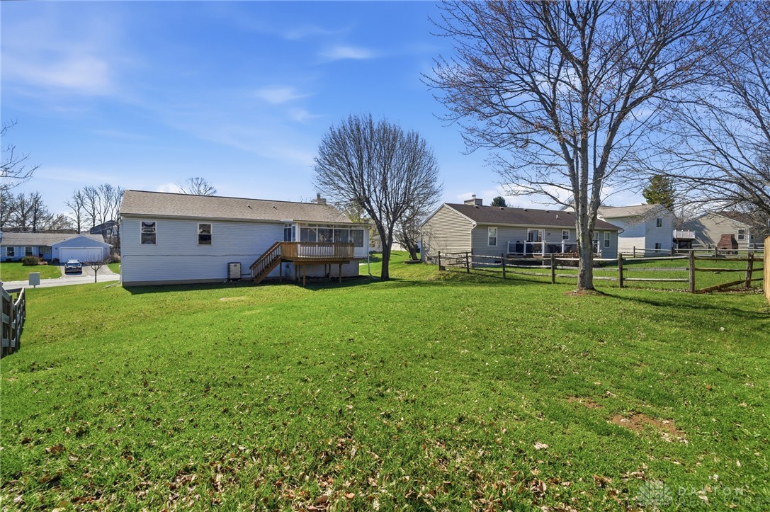 280 Stillpass Way Monroe, OH 45050 - Photo 44 of 49 This spacious backyard with a deck offers ample outdoor living potential for residents.