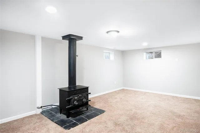 a view of an empty room with a fireplace