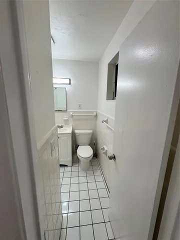 a bathroom with a tub a sink and a shower