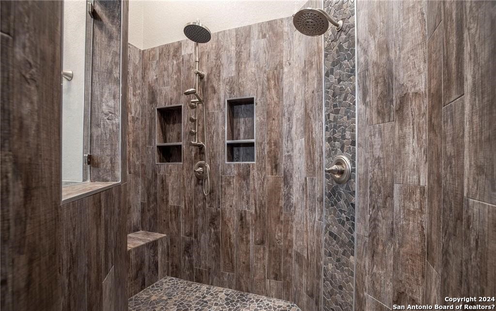 345 Laguna Road Bandera, TX 78003 - Photo 15 of 35 a bathroom with a shower