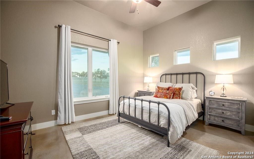345 Laguna Road Bandera, TX 78003 - Photo 19 of 35 a bedroom with a bed and a window