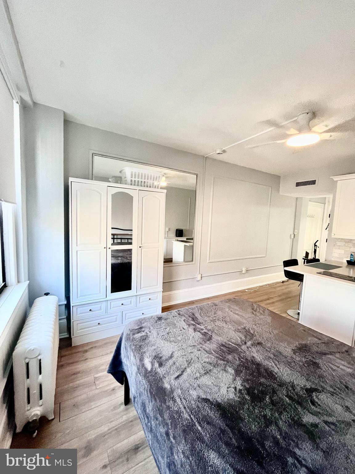 1324 Locust Street, Unit 1410 Philadelphia, PA 19107 - Photo 6 of 9 a spacious bedroom with a large bed and furniture