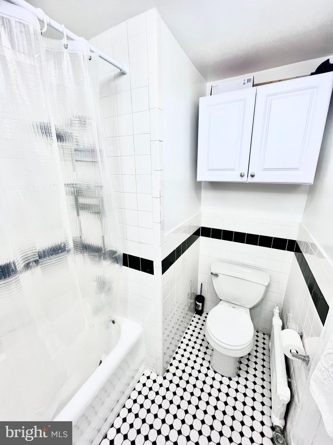 1324 Locust Street, Unit 1410 Philadelphia, PA 19107 - Photo 9 of 9 a bathroom with a bathtub and a shower