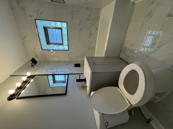 a bathroom with a toilet and a sink