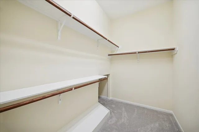 a view of an empty walk in closet