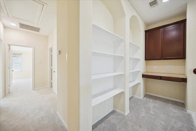 a view of an empty walk in closet