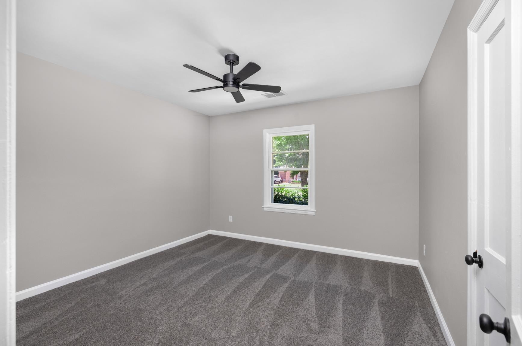 7662 Marvin Road Millington, TN 38053 - Photo 16 of 20 Neutral-toned walls complement the gray carpeting in this room