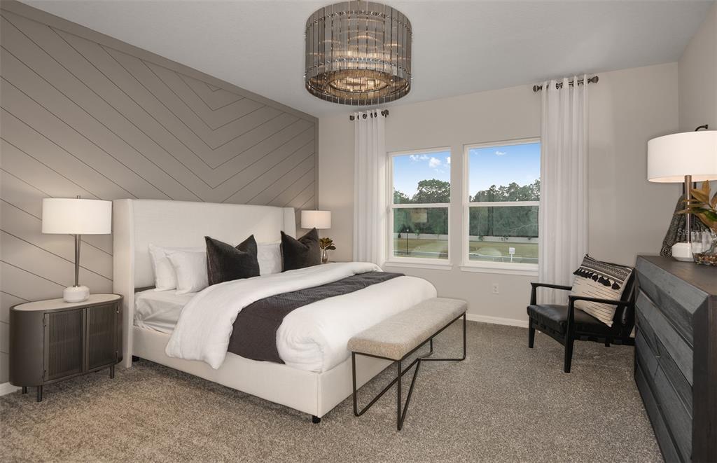 8188 Southwest 44th Ct Road Ocala, FL 34476 - Photo 13 of 27 a bedroom with a bed a table and chair