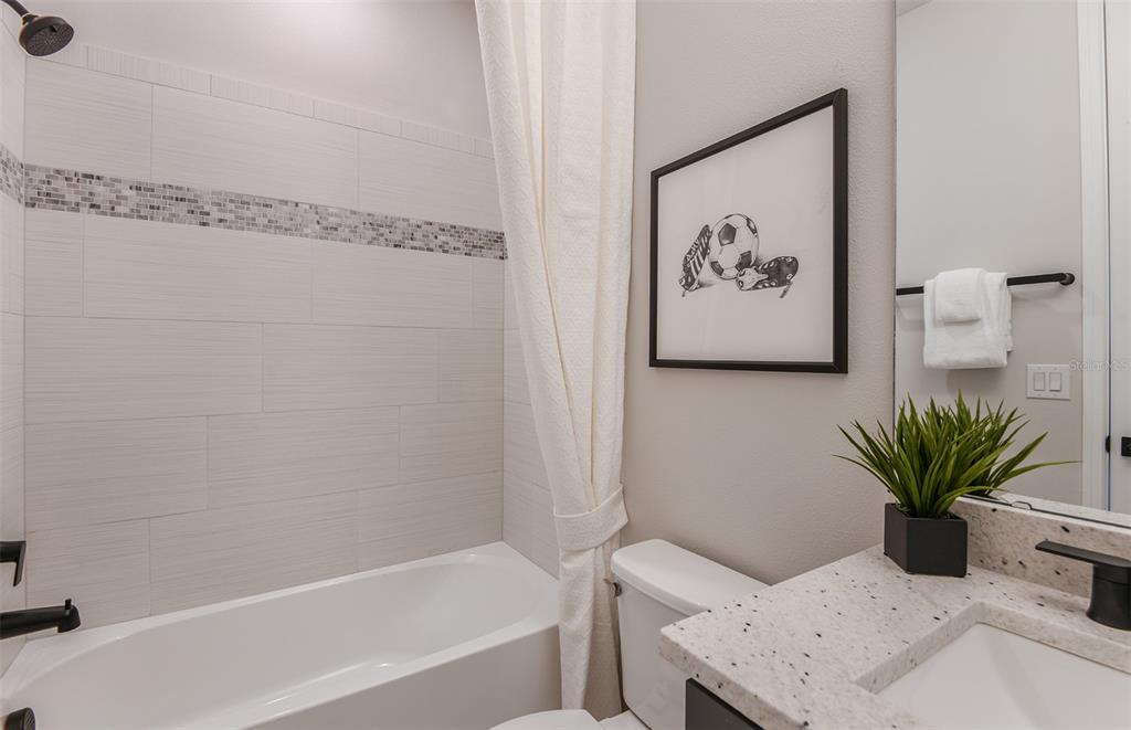 8188 Southwest 44th Ct Road Ocala, FL 34476 - Photo 19 of 27 a bath room with a bathtub and a shower